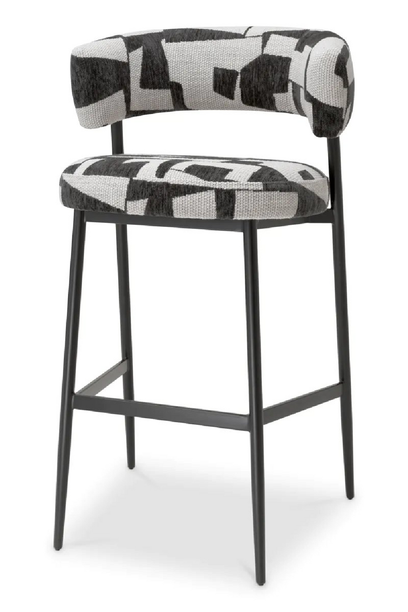 Tabouret de bar rembourré Brooklyn en noir avec pieds noirs | Eichholtz Folsom | Meubleluxe.fr