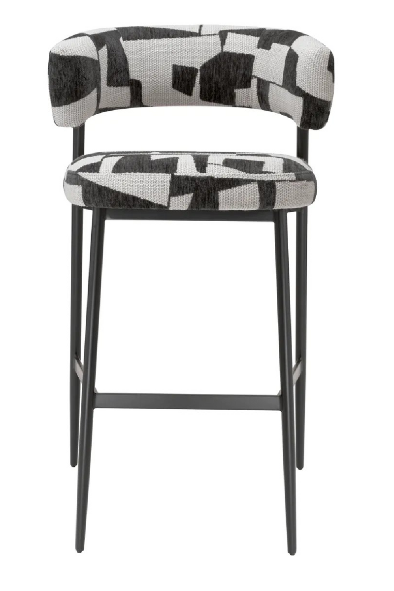 Tabouret de bar rembourré Brooklyn en noir avec pieds noirs | Eichholtz Folsom | Meubleluxe.fr