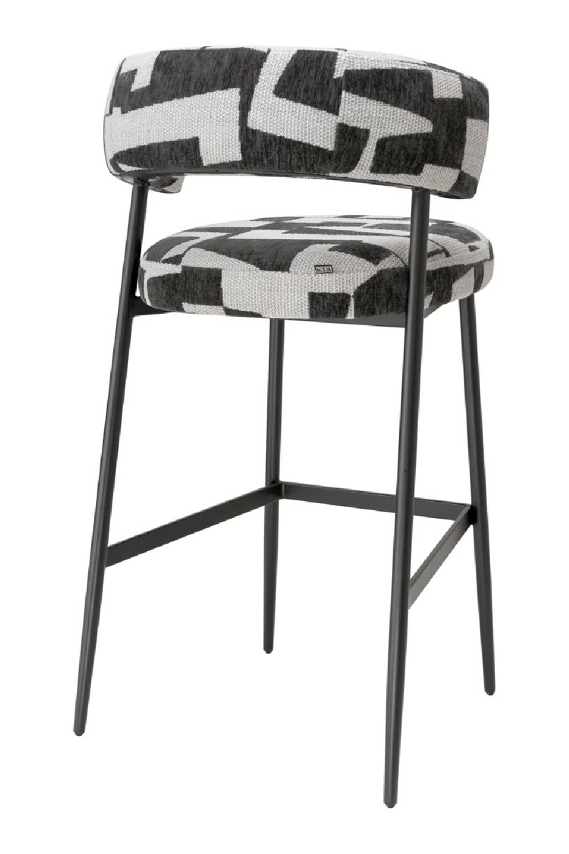 Tabouret de bar rembourré Brooklyn en noir avec pieds noirs | Eichholtz Folsom | Meubleluxe.fr