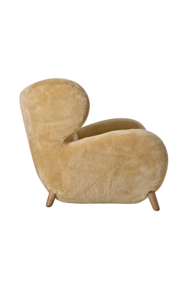 Real sheepskin armchair | Andrew Martin