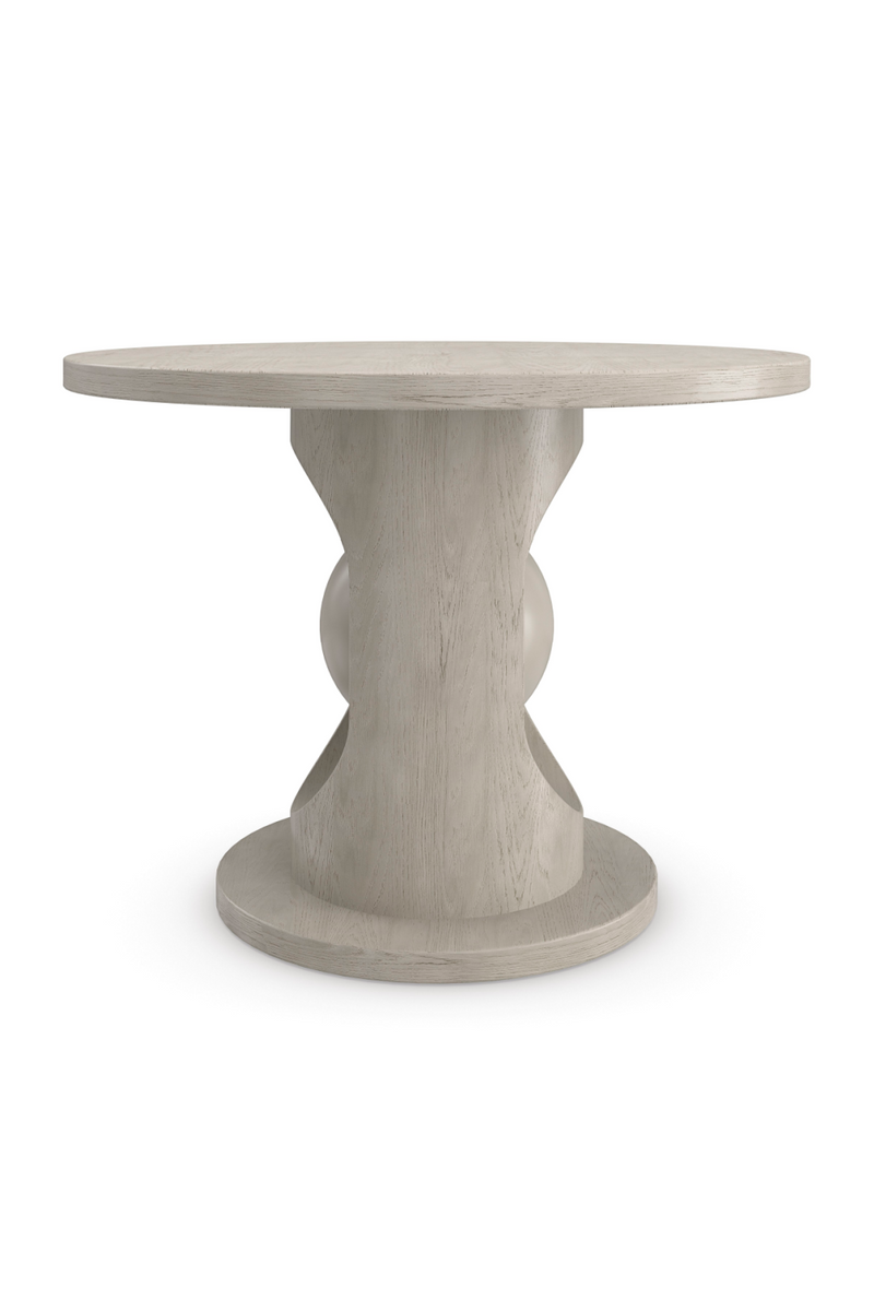 Table de salle à manger ronde en bois chêne taupe | Caracole Pearl | Meubleluxe.fr