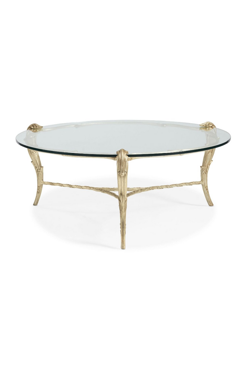 Table basse ronde en verre et feuilles d'acanthe dorées | Caracole Fontainebleau | Meubleluxe.fr