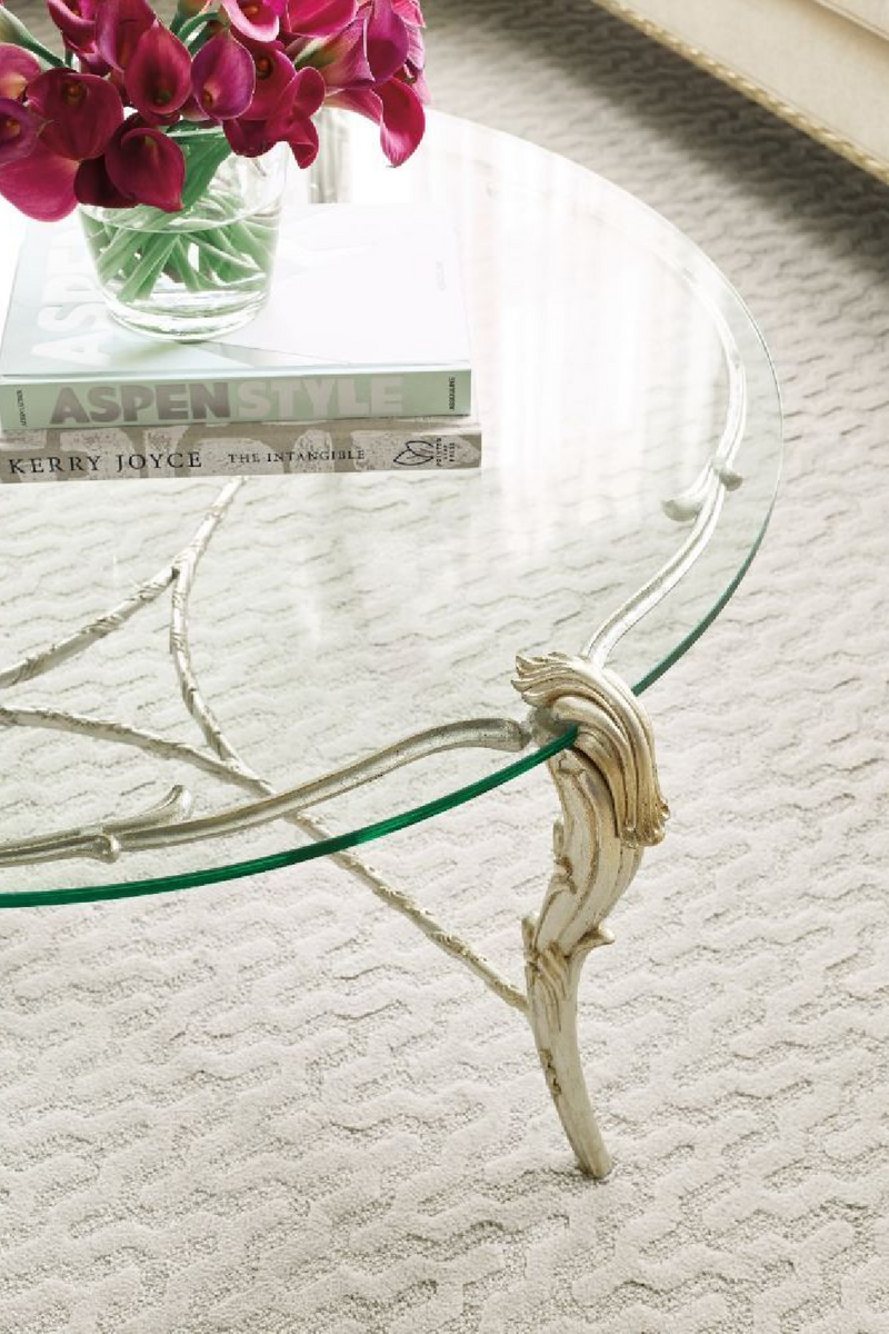 Table basse ronde en verre et feuilles d'acanthe dorées | Caracole Fontainebleau | Meubleluxe.fr